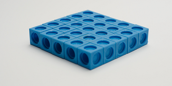 A rectangular prism 5 by 5 by 1 cm built with snap cubes.